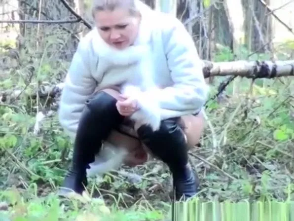 Two women take a pee outdoors in public