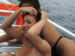 Sexy babes Aneta and Kora expose their magnificent big boobs on a boat