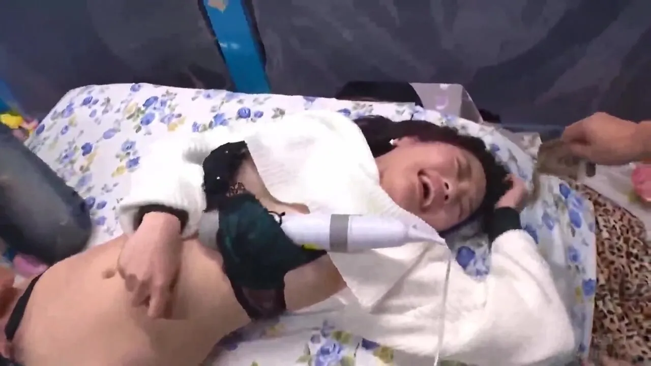 A machine vibrator is inserted into her, and she gives a blow job to her cock and cums on her face.