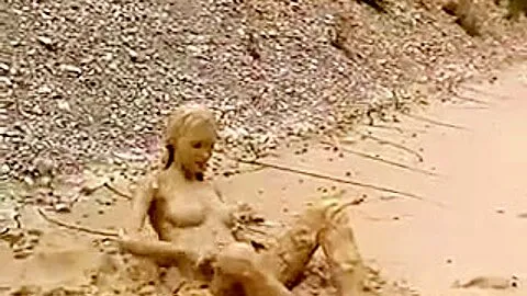 Lady masterbating in mud