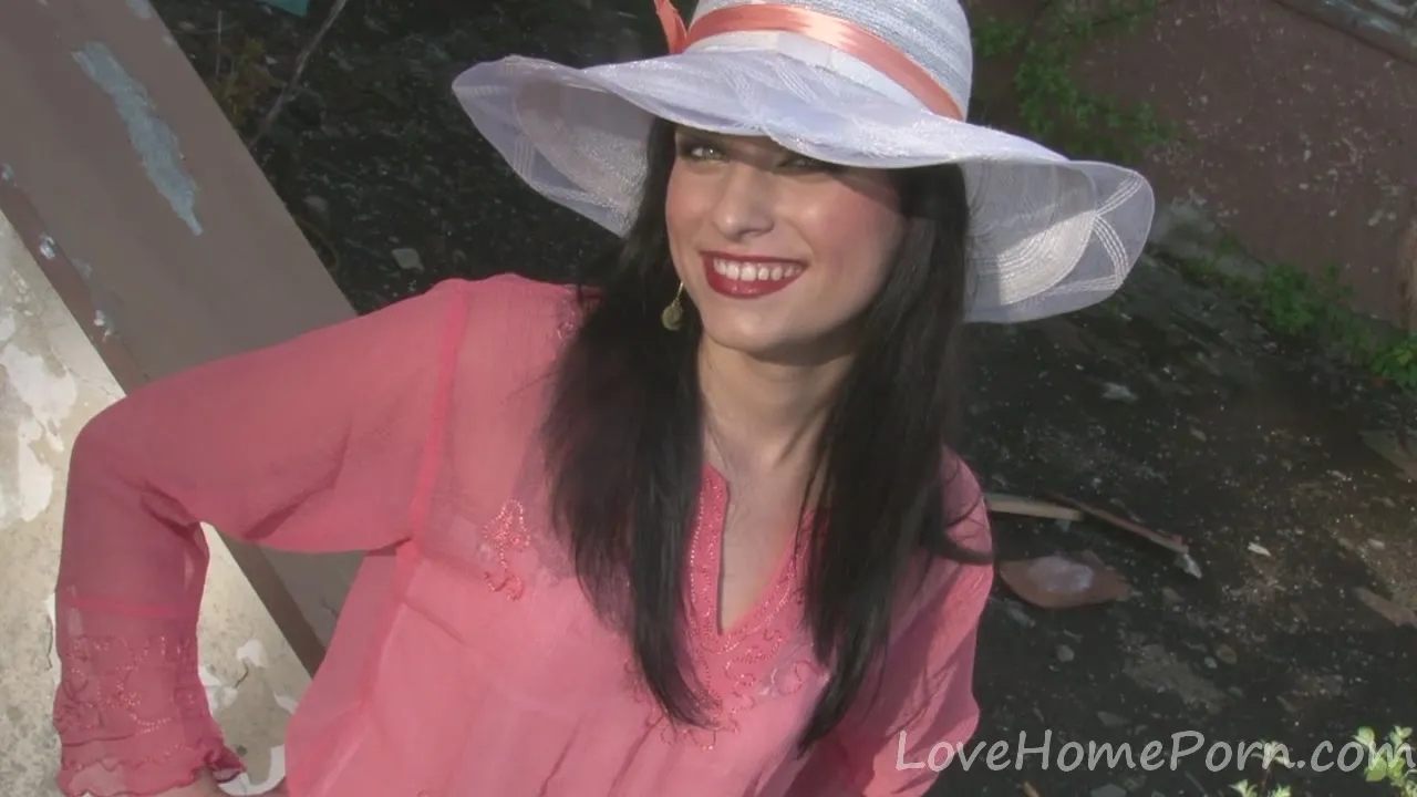 Hot babe poses in a white hat