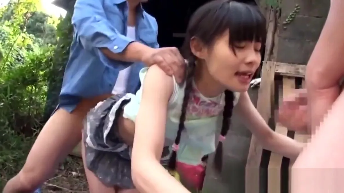 A beautiful girl is outdoors being fingered by two men and gets bukkake'd.