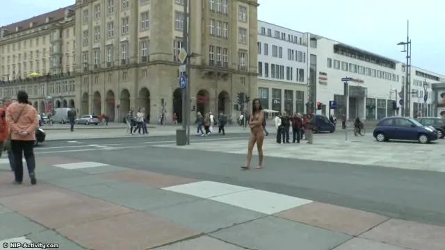 Long haired brunette walks naked in public in hd movie