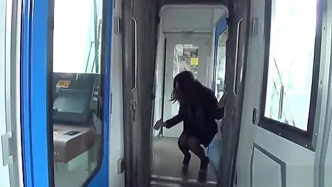 Asian pissing on train
