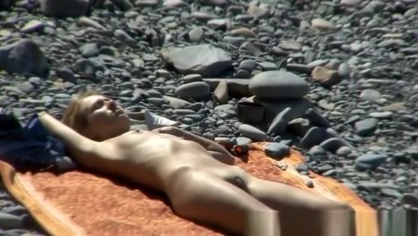 Couple hangs out on the beach
