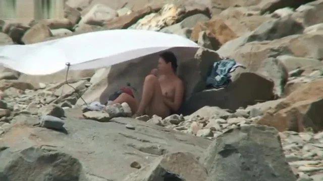 NUDIST COUPLES ON BEACH