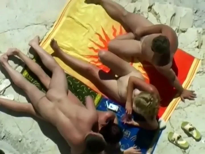 Horny blonde enjoys the beach