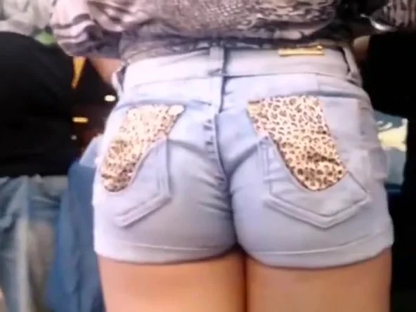 Tight jeans shorts stuffed in her butt crack