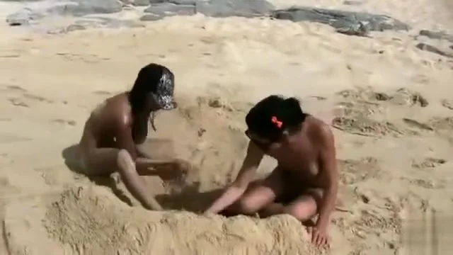 Nude beach foreplay and lesbian licking with brunettes