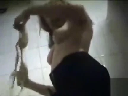 Young blonde changes into a sexy bikini