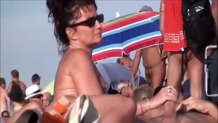 Horny mature nudists at a beach