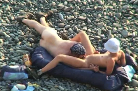 Voyeur on public beach. Oral sex