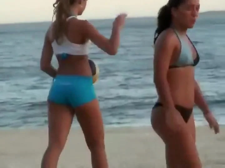 Girls playing volleyball in a tight bikini