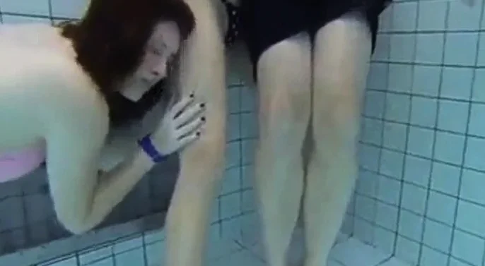 Teen Gives Handjob In Public Pool