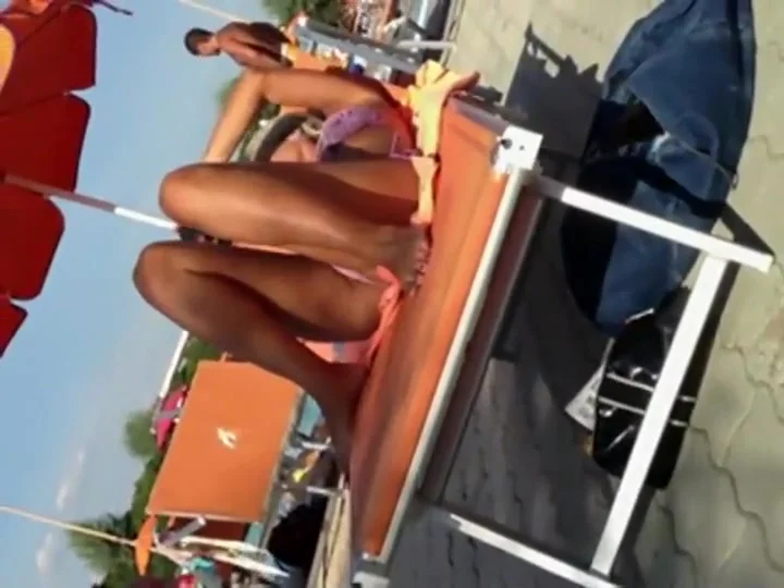 Milf lying by the pool and touching pussy