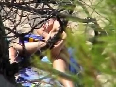 Aroused girl rubbing her pussy on a beach