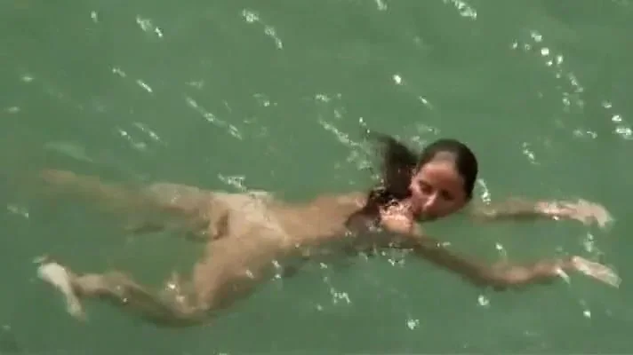 Incredible naked girl takes a swim