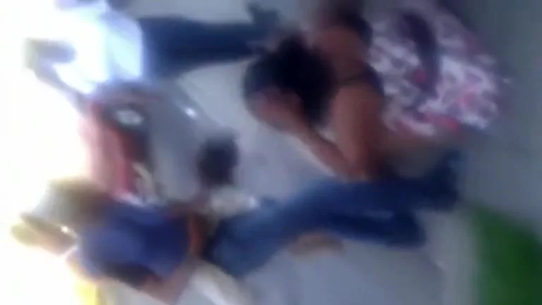 Two jealous women beating each other up