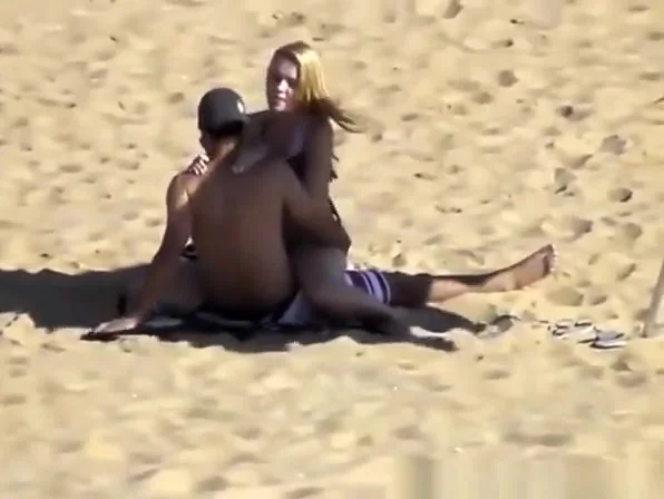 Blonde girl rides her boyfriend’s dick in beach