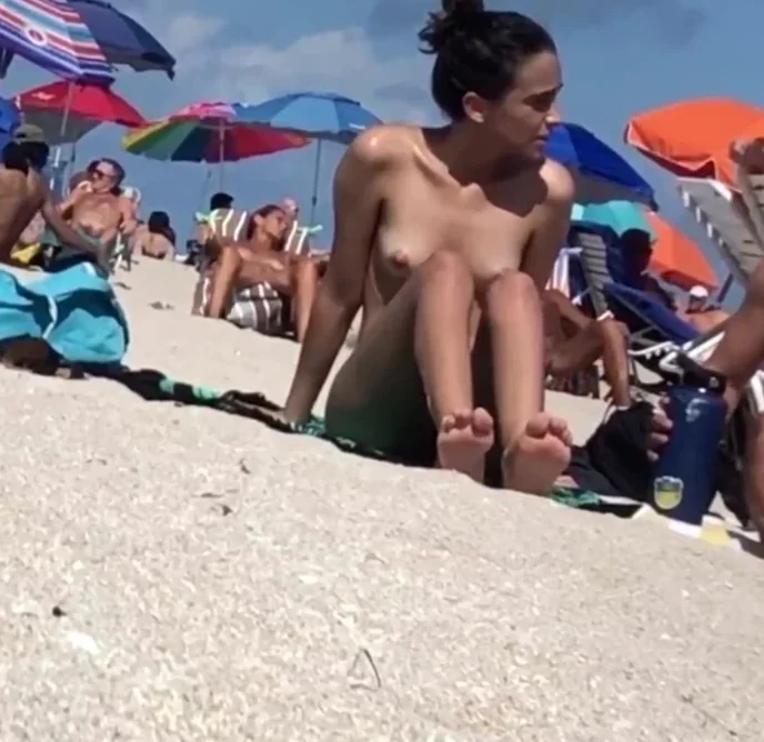 Beautiful Latina showing her pussy on nude beach