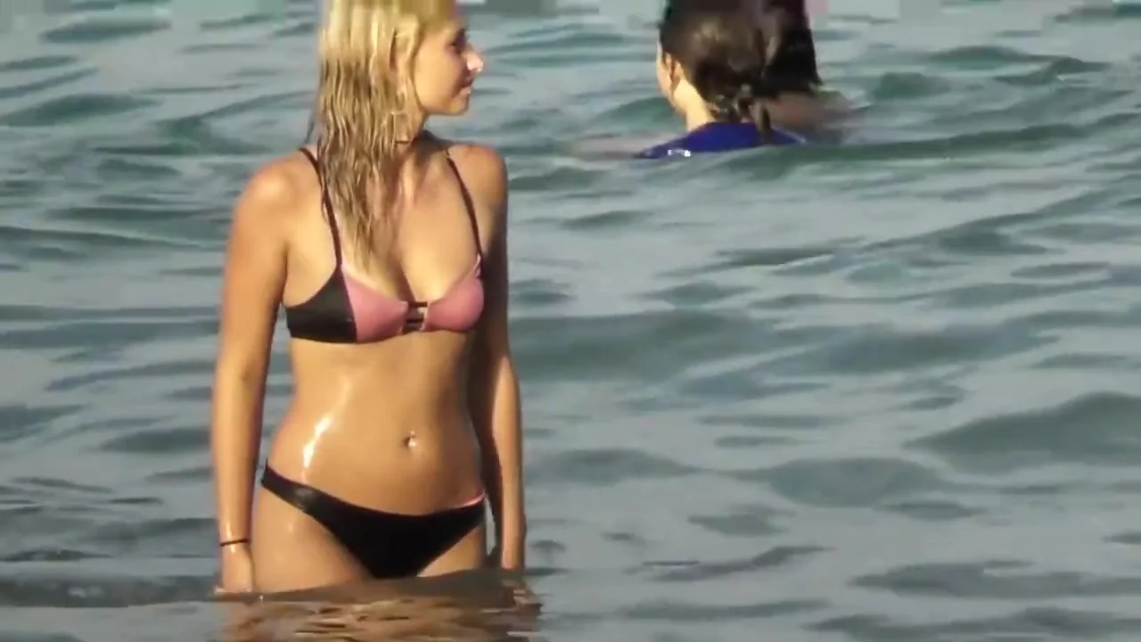blond girl gets dirty on beach