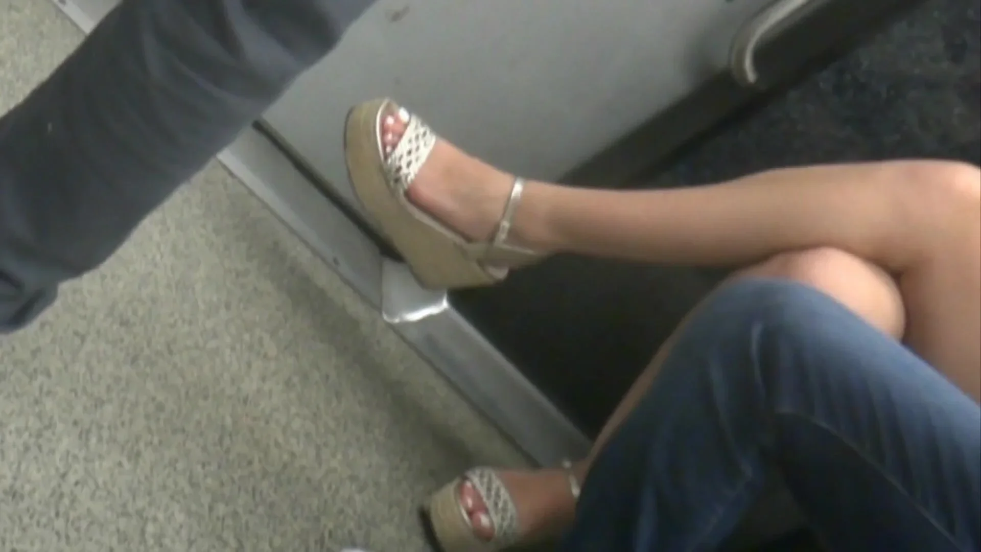 Young brunette, sexy legs in wedges heels