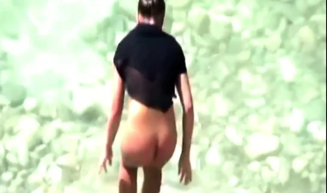 stepmother wades naked in the surf