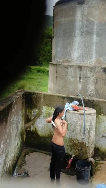 Indian Village Girl Bathing Near Water Tank Outdoor