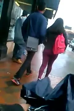 Candid booty in dark red jeans