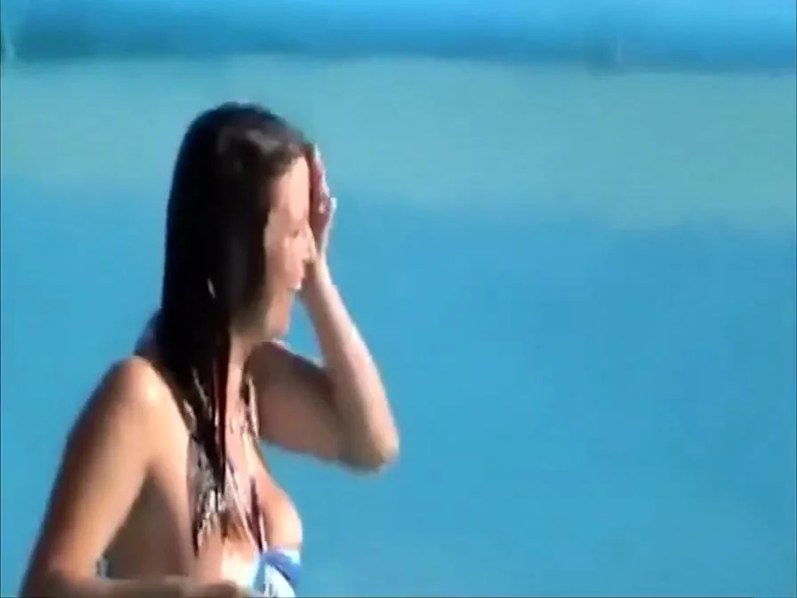 Busty girl's tit pops out while she was going down the waterslide