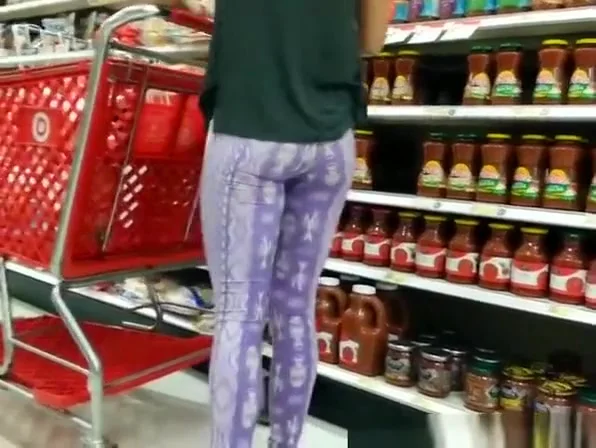 Woman in purple leggings with nice ass