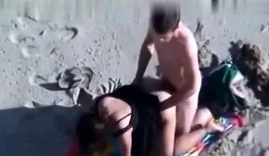 Amateur girl masturbating on public beach