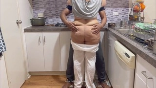 Curvy Indian MILF with a massive rear gets pleasured by her friend's husband in the kitchen - passionate kisses and loud moans