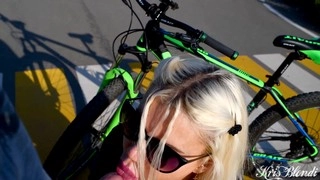 Busty tattooed blonde gets so aroused during a bike ride that she gives a passionate blowjob in the middle of an intersection