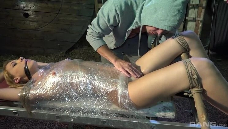 Aika May is plastic wrapped to a ladder while her Dom vibrates her clit