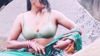 Marvelous Silk auntie from Telugu bathes in waterfall with sexy talk.