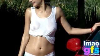 Two incredibly sexy brunettes giving a nude car wash, flaunting their large perky breasts and stunning buttocks